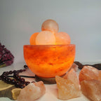 Himalayan salt bowl lamp with massage balls.